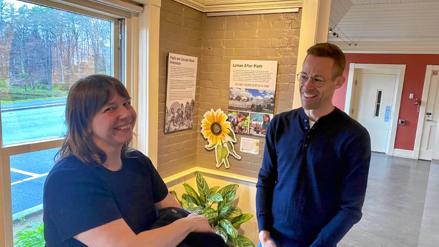 Sarah Loomis, left, the manager of education at Smith’s Lyman Conservatory, and Colin Hoag, an associate professor of anthropology, stand at the conservatory’s Church Gallery, currently hosting an exhibit of writer and Smith alumnae Sylvia Plath. 
